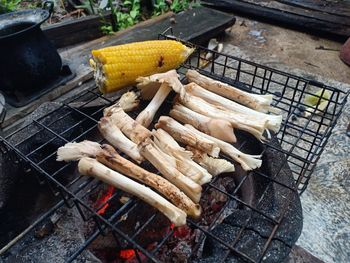 High angle view of meat on barbecue grill