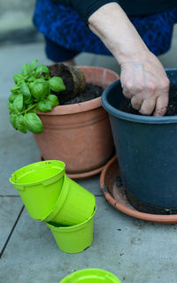 Midsection of person planting