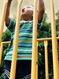 Close-up of boy playing at playground