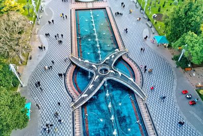 High angle view of swimming pool by buildings in city