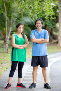 Full length portrait of a smiling young woman