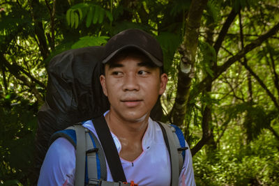 Portrait of teenage boy in forest