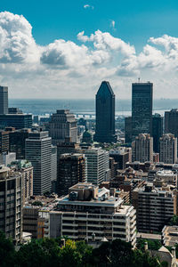 Buildings in city against sky