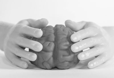 Close-up of people hands over white background