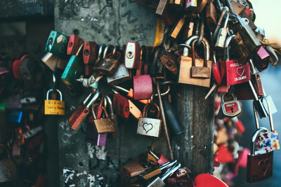 Close-up of padlocks hanging on railing