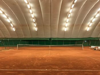 Empty illuminated tennis court