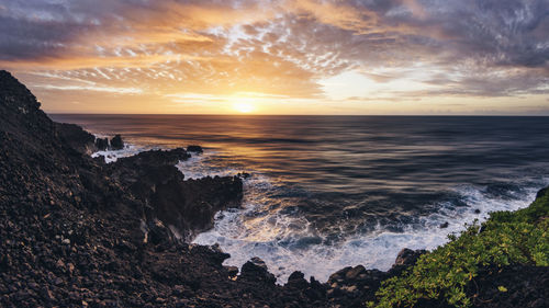 Scenic view of sea against sky during sunset