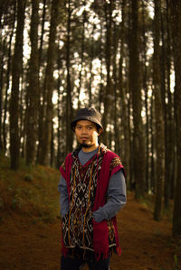 Portrait of woman standing in forest