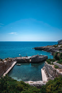 Scenic view of sea against clear blue sky