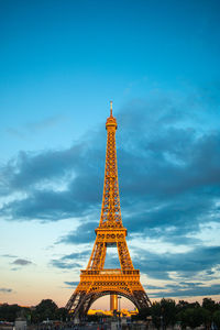 Low angle view of tower against cloudy sky