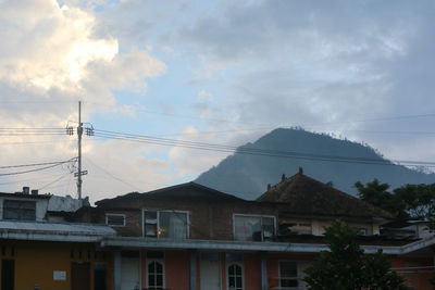 Low angle view of houses and buildings against sky