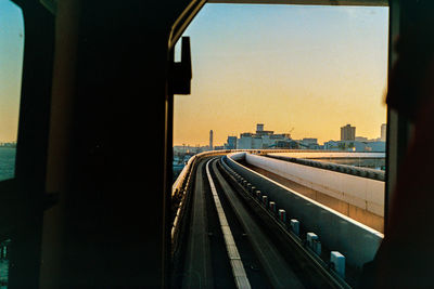 Railroad tracks seen through train window