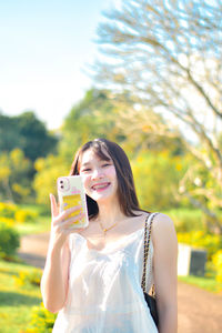 Young woman using mobile phone