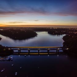 High angle view of light trail on como bridge over georges river against sky at dusk