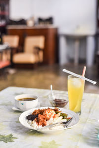 Traditional hot and spicy rice plate and juice