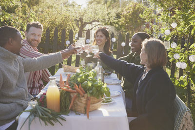 Friends having meal in garden