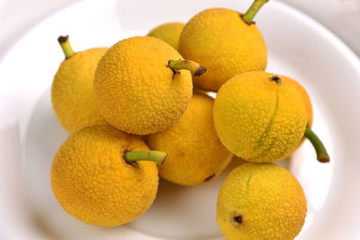 High angle view of lemons in plate