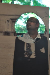 Portrait of young man looking away