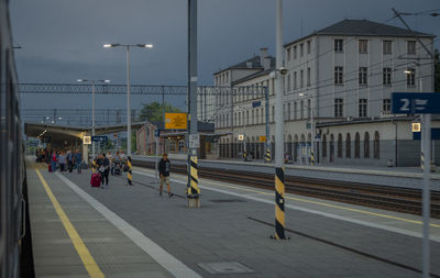 People walking on street in city at night