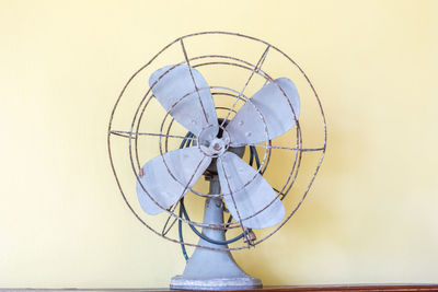 Close-up of electric fan against sky