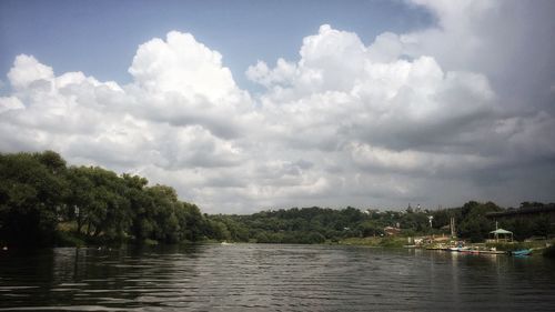 Scenic view of calm sea against cloudy sky