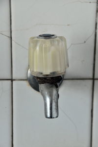 Close-up of faucet in bathroom