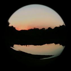 Scenic view of sunset over lake