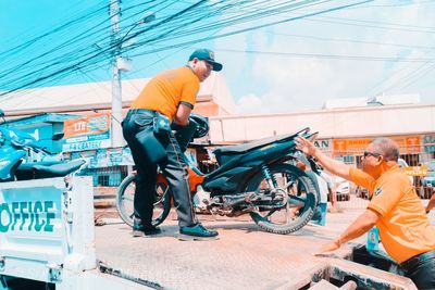 Side view of people working at construction site