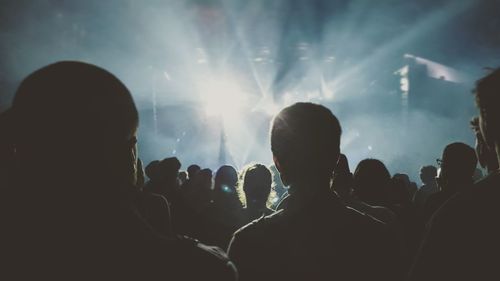 Silhouette people at music concert