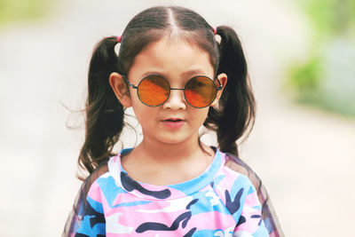 Portrait of cute girl wearing sunglasses