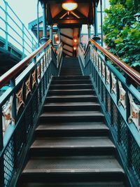 Low angle view of steps leading towards footbridge