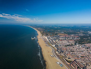 High angle view of sea and buildings against sky