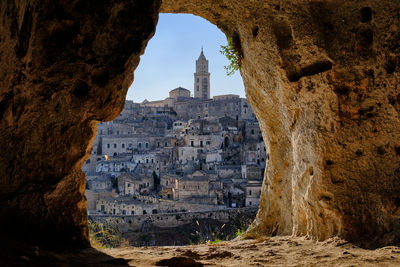 Buildings seen through cave