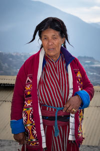 Portrait of woman standing outdoors