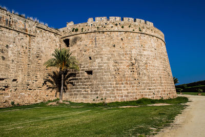 Low angle view of old ruins against sky