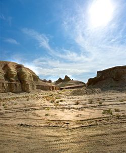 Rock formations on landscape against sky