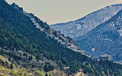 Panoramic view of mountain range against clear sky