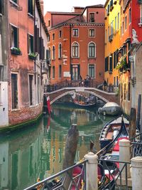 View of canal passing through city buildings