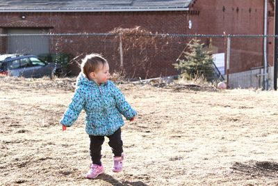 Full length of cute girl standing on floor