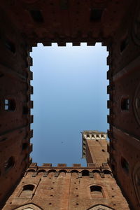 Low angle view of historic building against sky