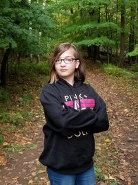 Portrait of teenage girl standing on land