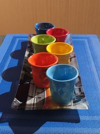 High angle view of multi colored glass on table