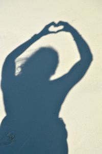 Shadow of man on heart shape