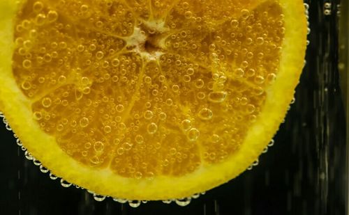 Close-up of lemons on wooden table