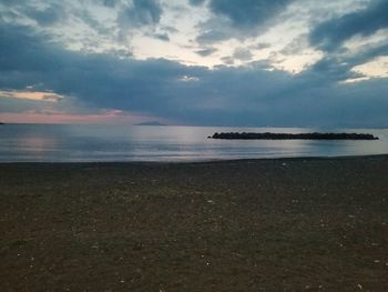 Scenic view of sea against sky at sunset