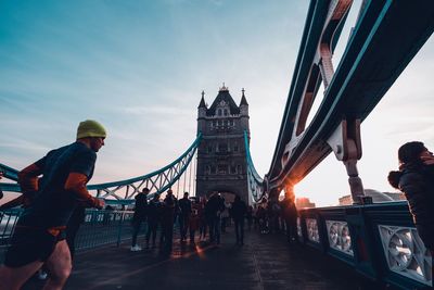 People walking on bridge