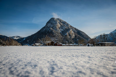 Scenic view of snowcapped mountains against sky