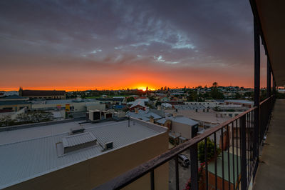 High angle view of buildings against sky during sunset