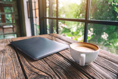 Close-up of coffee cup on table