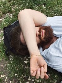 High angle view of man lying on field